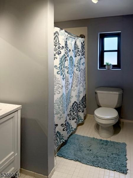 58 Sandra Cir Unit B3, Westfield Town, NJ 07090 - full bath featuring vanity, tile patterned flooring, and curtained shower