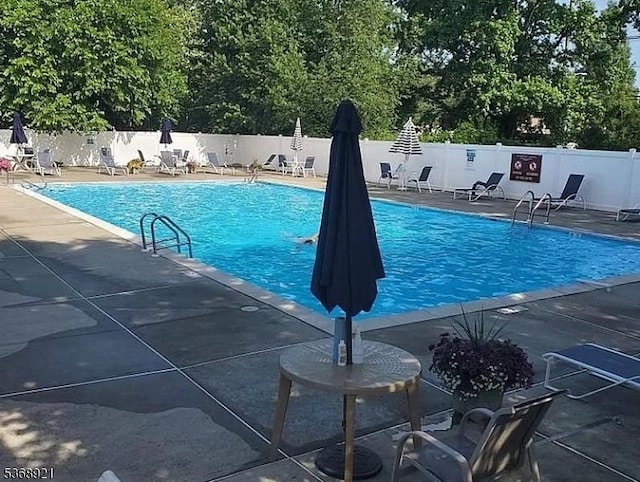 58 Sandra Cir Unit B3, Westfield Town, NJ 07090 - community pool featuring a patio area and view of scattered trees