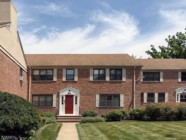 58 Sandra Cir Unit B3, Westfield Town, NJ 07090 - view of front of property with a front yard, brick siding, and a shingled roof