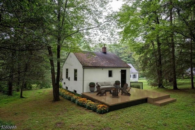 37 Furnace Rd, Chester Twp, NJ 07930 - rear view of house with a deck, outdoor lounge area, a lawn, a chimney, and roof with shingles
