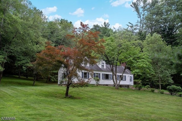 37 Furnace Rd, Chester Twp, NJ 07930 - view of front of home with a front lawn, a forest view, and a chimney