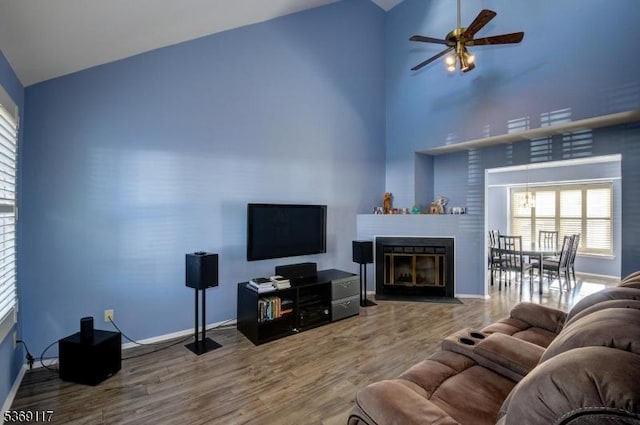 277 Edgeware Ct, Franklin Twp, NJ 08873 - living room featuring wood finished floors, ceiling fan, a fireplace with flush hearth, and high vaulted ceiling