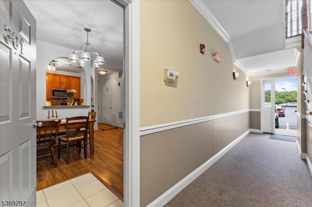 301 Rainbow Way Unit 301, Lopatcong Twp, NJ 08865 - corridor with a chandelier, crown molding, and light tile patterned flooring