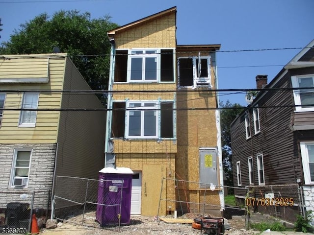 497 S 10th St, Newark City, NJ 07103 - view of front facade with cooling unit and a gate