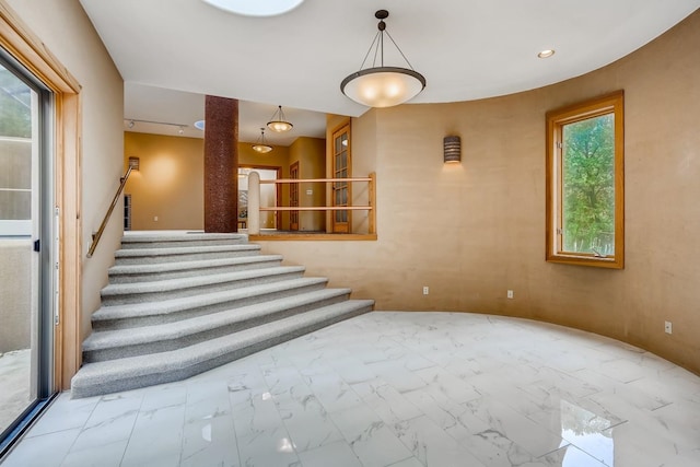 stairway with light tile flooring