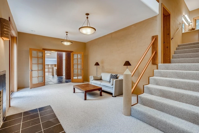 tiled living room featuring french doors