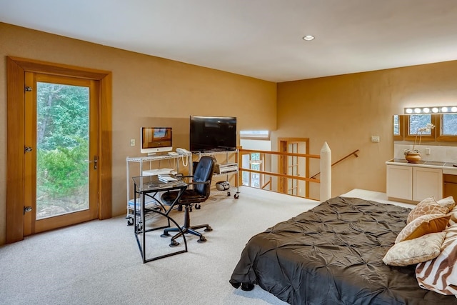 carpeted bedroom with access to exterior