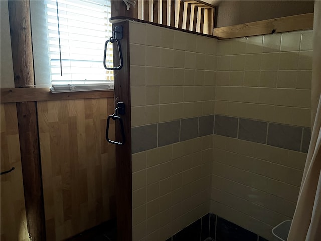 bathroom with a tile shower