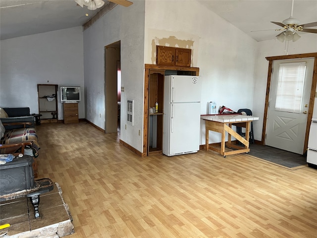 living room featuring high vaulted ceiling, ceiling fan, and light hardwood / wood-style floors