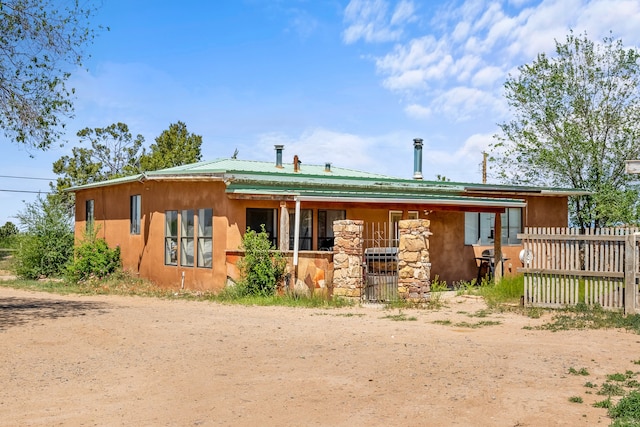 rear view of house with central AC