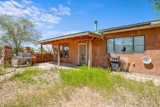 rear view of house with a patio