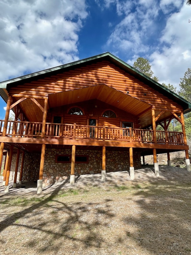 back of house featuring a deck