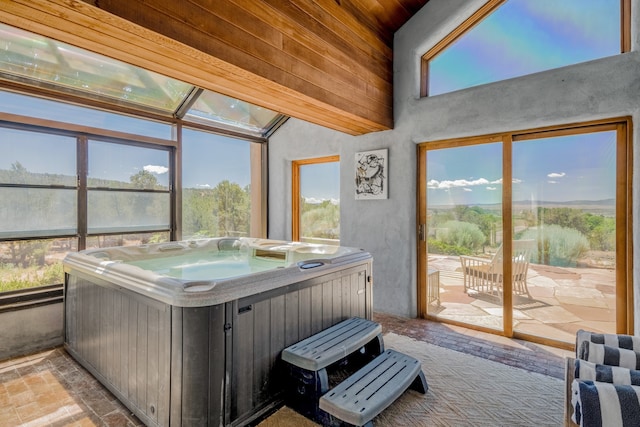 sunroom with a jacuzzi