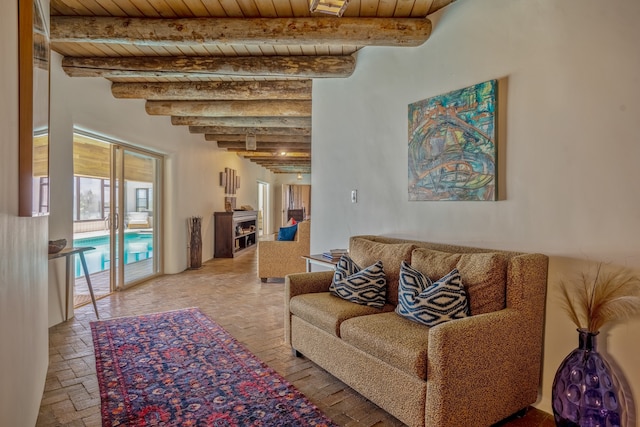 living room with wooden ceiling and beamed ceiling