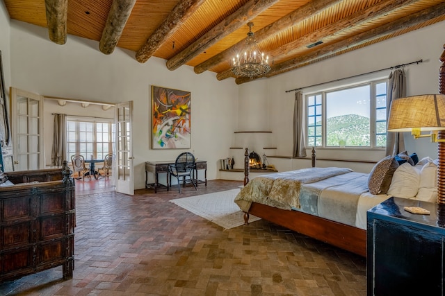 bedroom with wood ceiling, beamed ceiling, french doors, a chandelier, and multiple windows