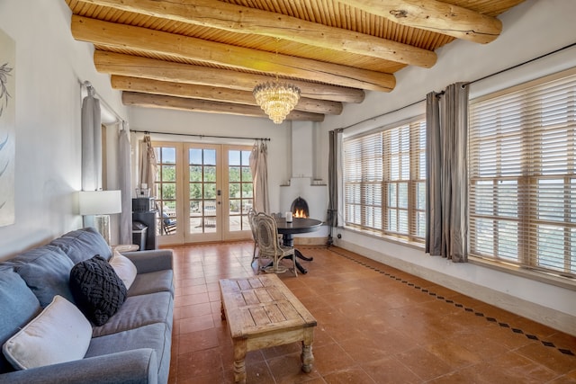 sitting room featuring wood ceiling, tile patterned floors, french doors, beamed ceiling, and an inviting chandelier