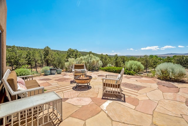 35 Camino Monte Azul, Arroyo Hondo, NM 87571 - view of patio featuring a fire pit