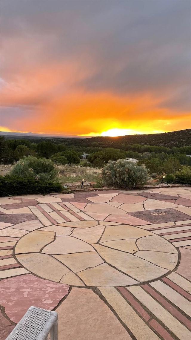 view of patio terrace at dusk