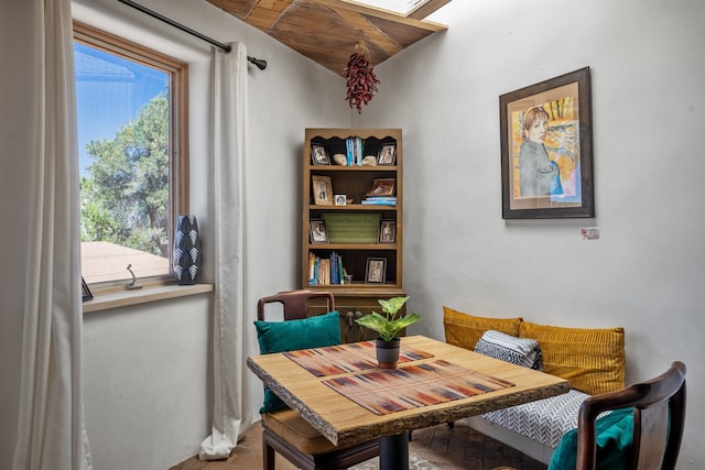 dining area with wooden ceiling and breakfast area