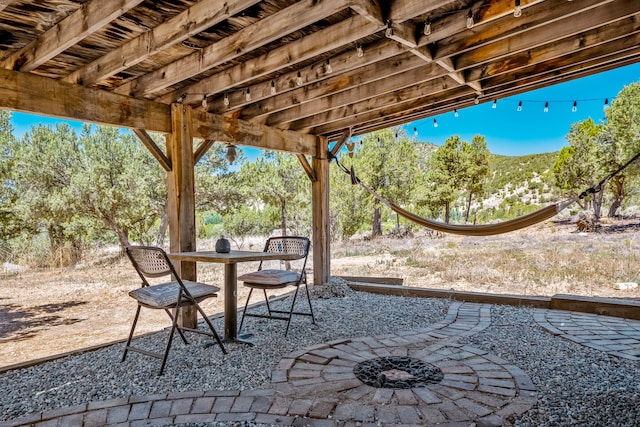 view of patio / terrace featuring a fire pit