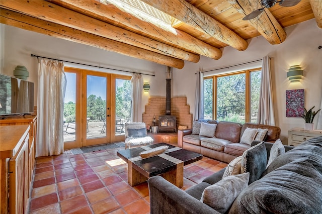 living room featuring beam ceiling, wood ceiling, a wealth of natural light, and light tile patterned flooring