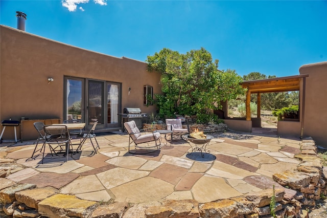 view of patio featuring a grill