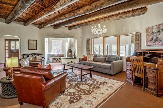 living room with beam ceiling, a wealth of natural light, a chandelier, and wooden ceiling