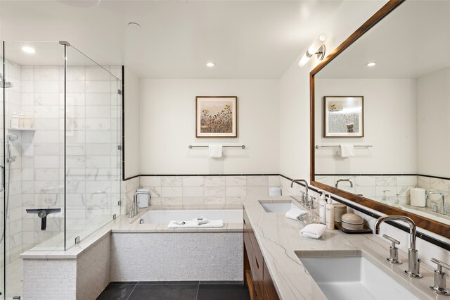 bathroom with shower with separate bathtub, tile floors, and dual bowl vanity