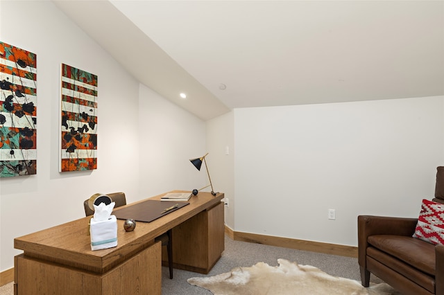 office area featuring light carpet and vaulted ceiling