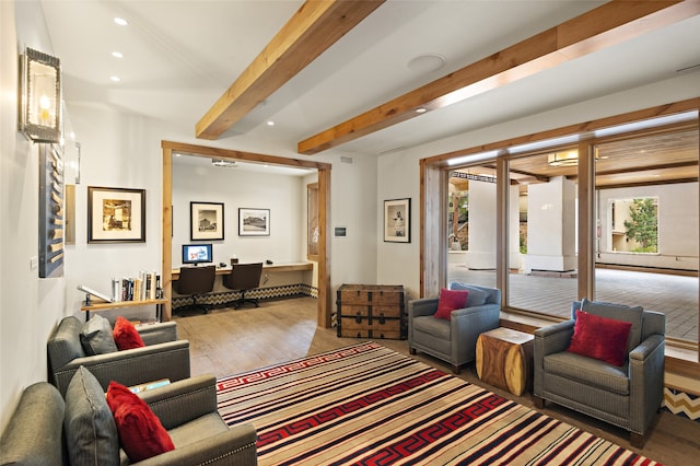 living room with light wood-type flooring and beam ceiling