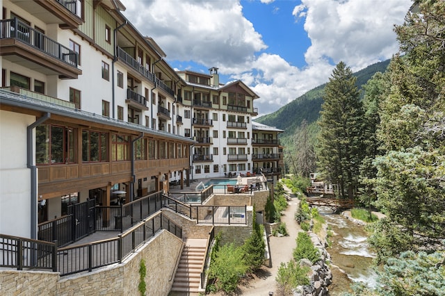 view of property with a water and mountain view