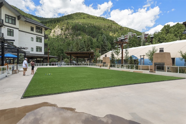 surrounding community with a pergola, a yard, and a patio area