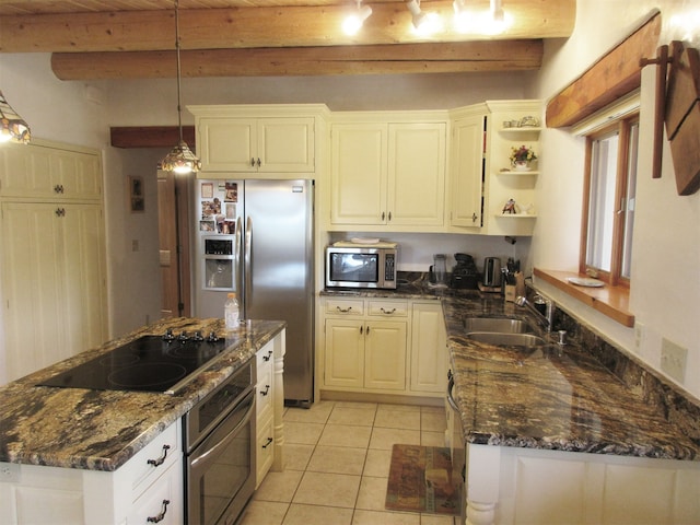 kitchen featuring appliances with stainless steel finishes, a kitchen island, beam ceiling, light tile floors, and sink