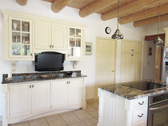 kitchen with oven, decorative light fixtures, black electric cooktop, and beamed ceiling