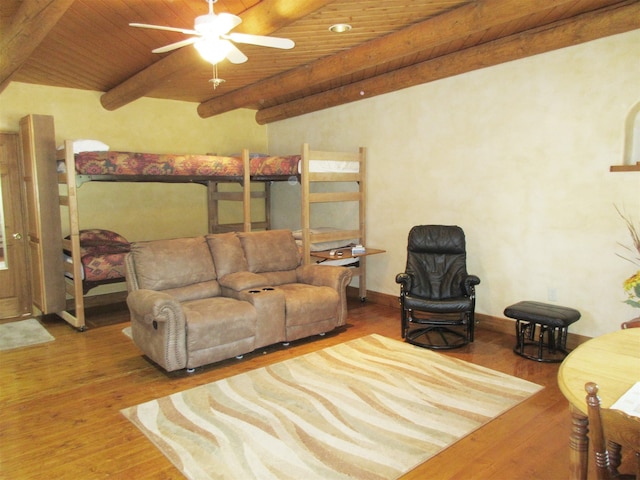 living room with wood ceiling, beam ceiling, ceiling fan, and hardwood / wood-style flooring