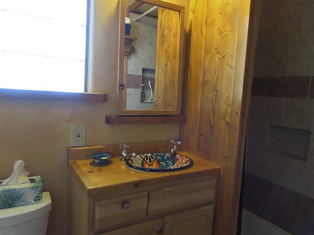 bathroom featuring toilet and vanity