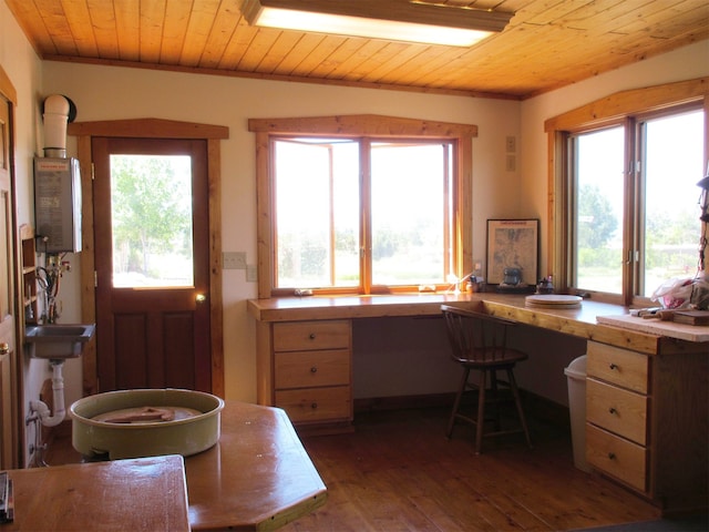 office area featuring wooden ceiling, water heater, and dark wood-type flooring