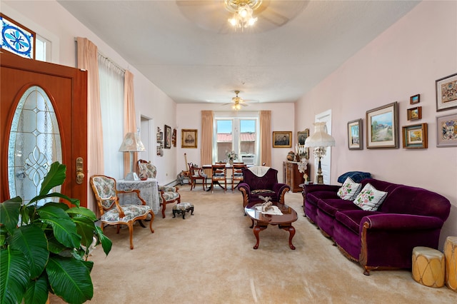 carpeted living room with ceiling fan and cooling unit