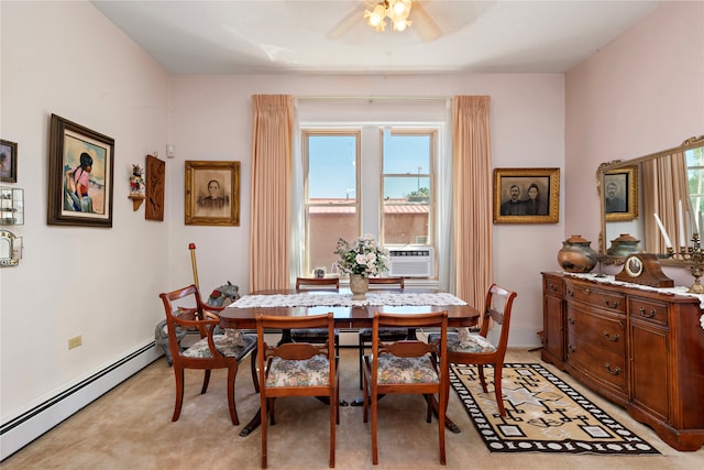 dining area with baseboard heating, light carpet, ceiling fan, and a healthy amount of sunlight