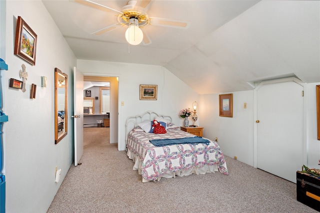 carpeted bedroom featuring ceiling fan, lofted ceiling, and a baseboard heating unit