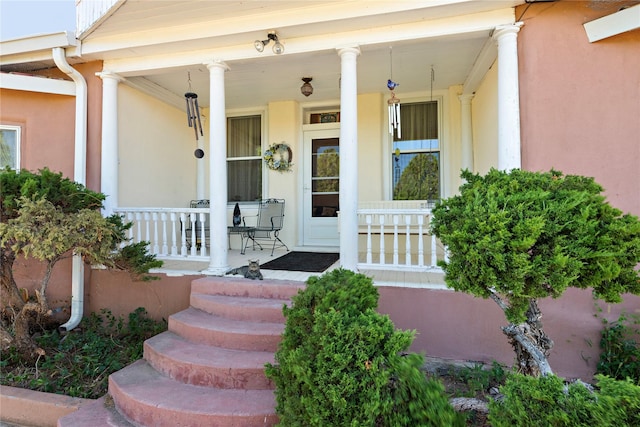 doorway to property with a porch