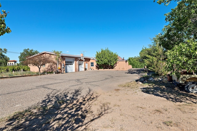 ranch-style home featuring a garage