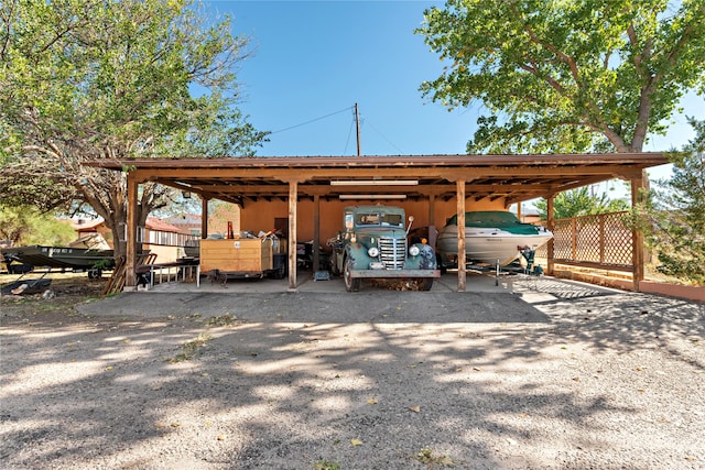 view of parking / parking lot featuring a carport