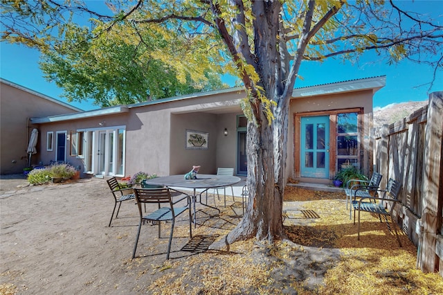 rear view of property featuring a patio area