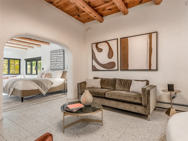 interior space with a baseboard radiator, wood ceiling, and beam ceiling