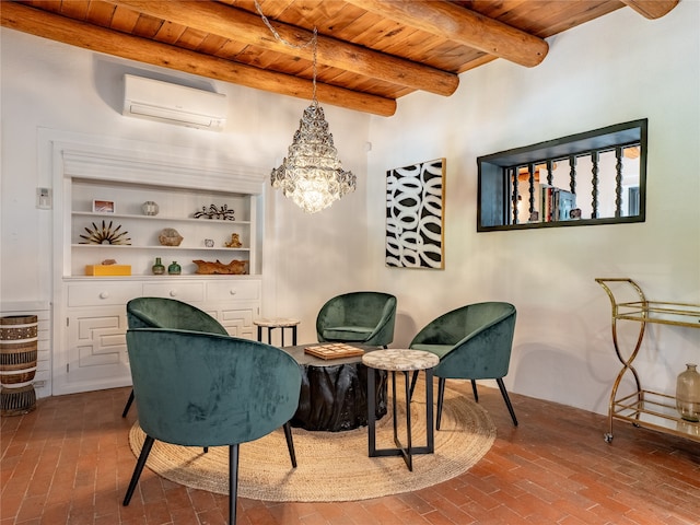 sitting room featuring an AC wall unit, built in features, wood ceiling, and an inviting chandelier