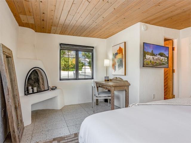 tiled bedroom with wood ceiling