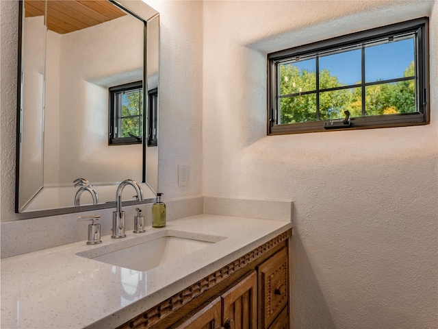 bathroom with wooden ceiling and oversized vanity