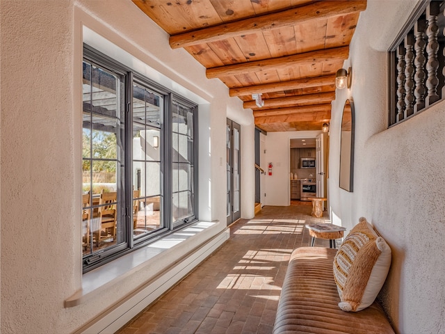 sunroom / solarium with wooden ceiling and beam ceiling