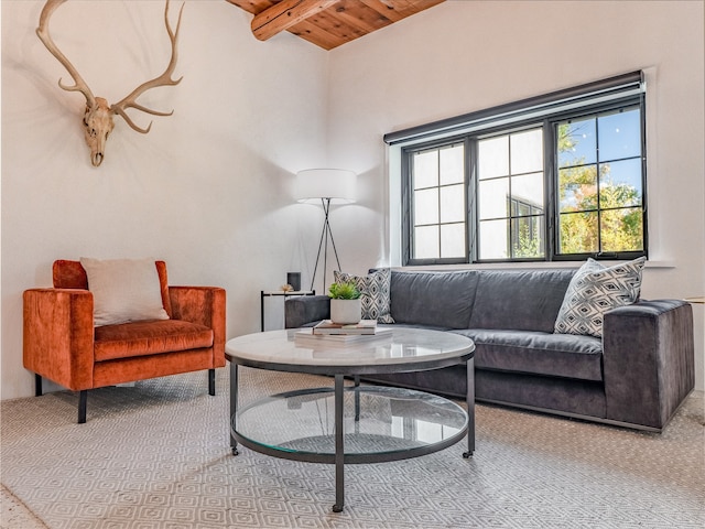 living room featuring light carpet, wooden ceiling, and beamed ceiling